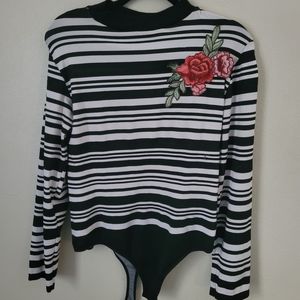 Cute 2x/3x Black and White Stripe Shirt with a flower on the shoulder.